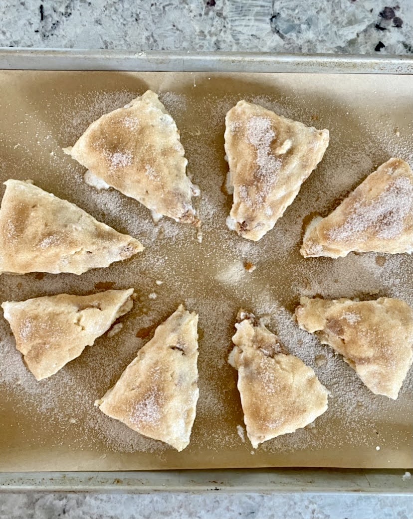 cinnamon scones on a baking sheet