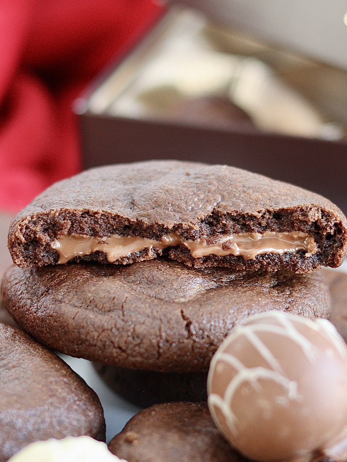 chocolate cookie broken open to show chocolate truffle filling