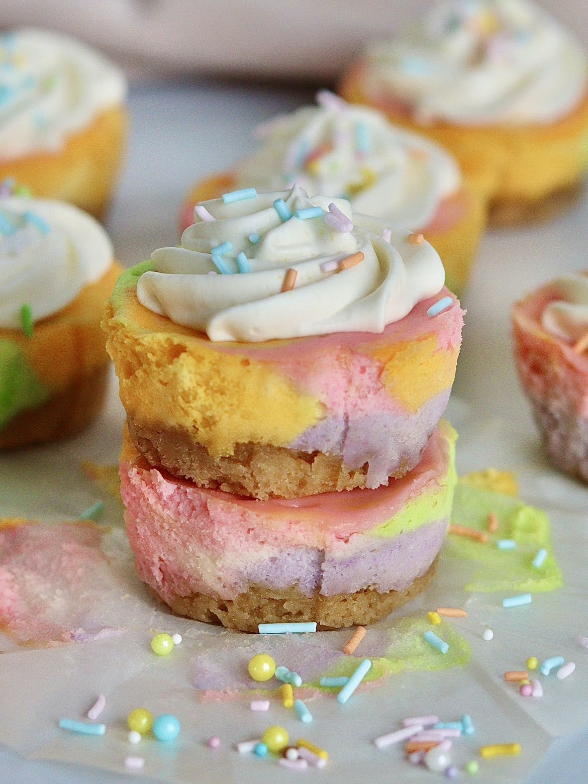 two mini unicorn cheesecakes stacked on top of each other