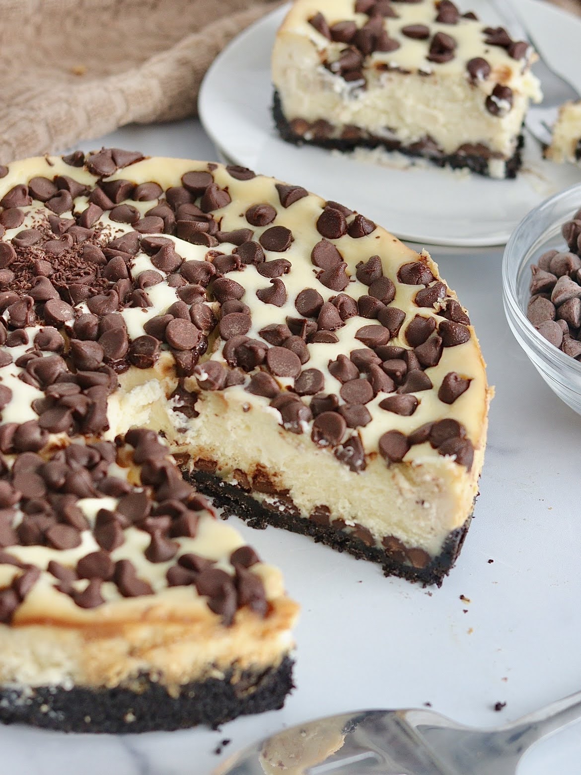 Overhead photo of a sliced chocolate chip cheesecake.