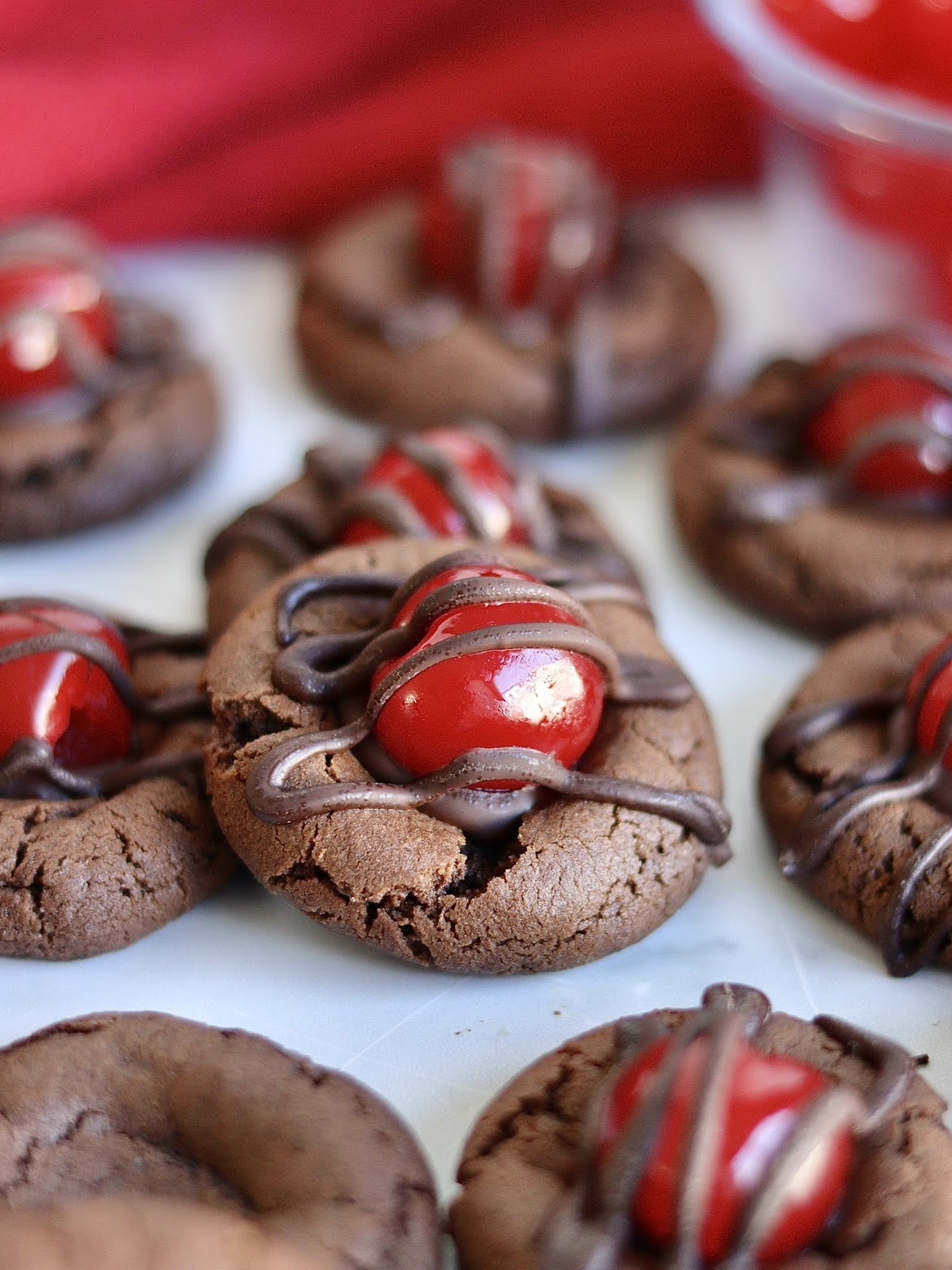 A close up photo of a finished chocolate covered cherry cookie