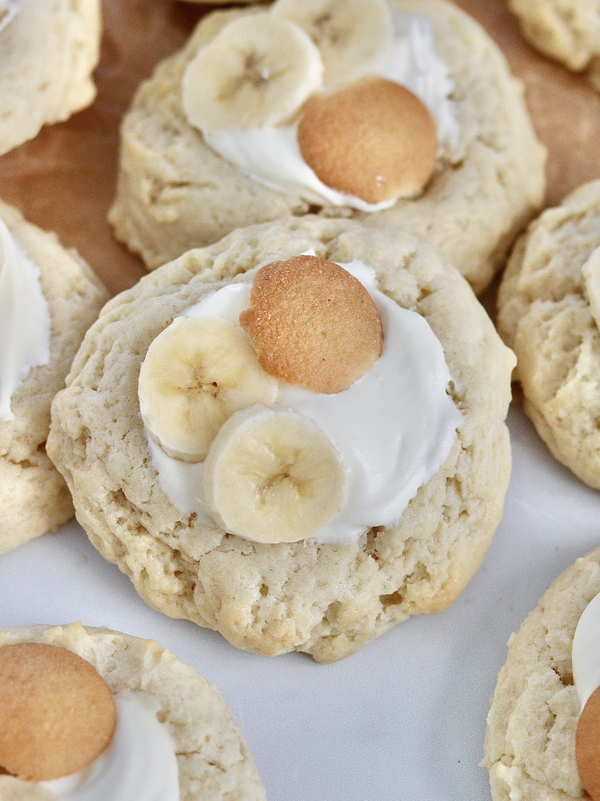An up close photo of a banana cream pie cookie with other cookies in the background.