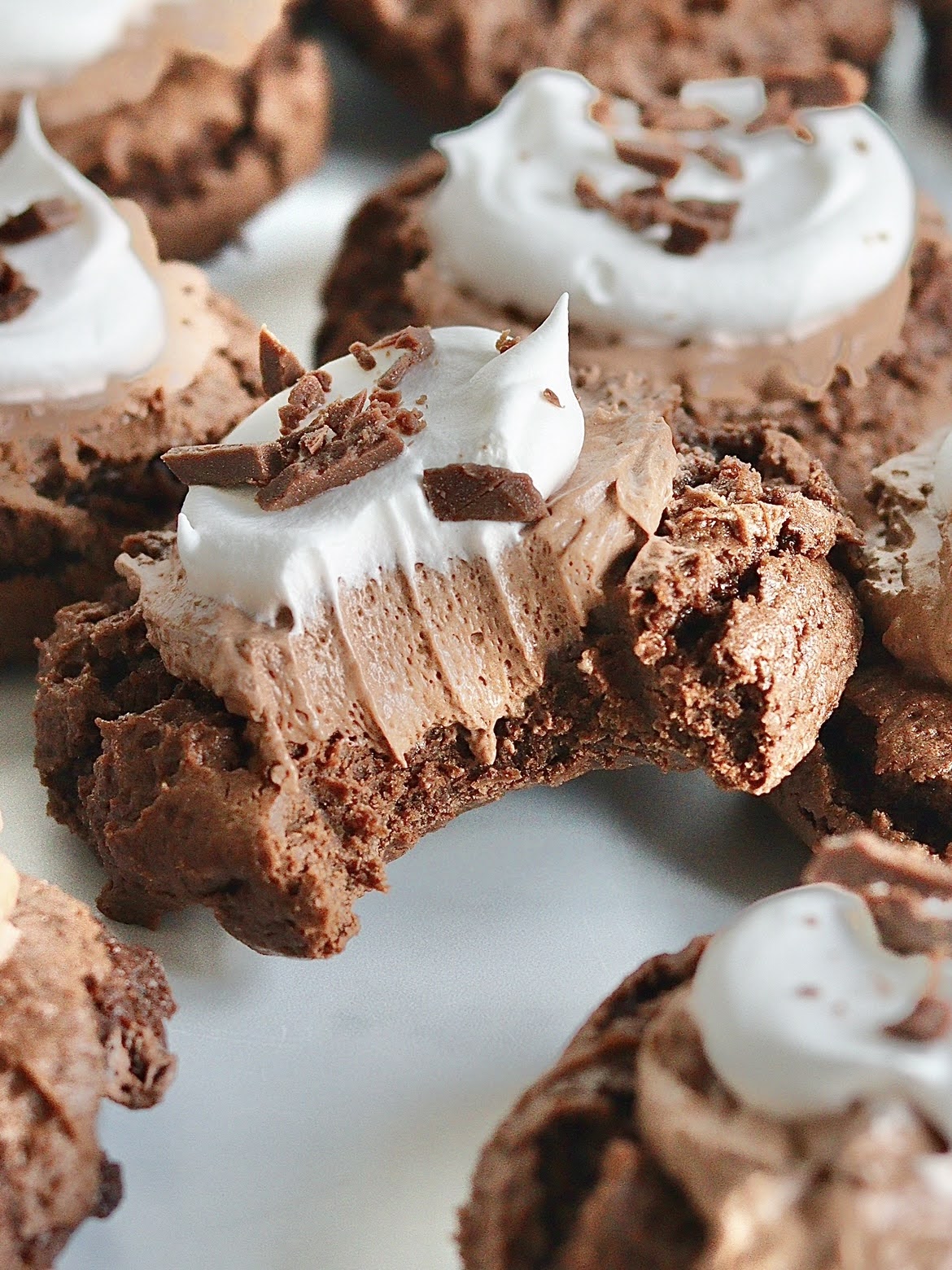 A French Silk Pie cookie with a bite taken out of it.