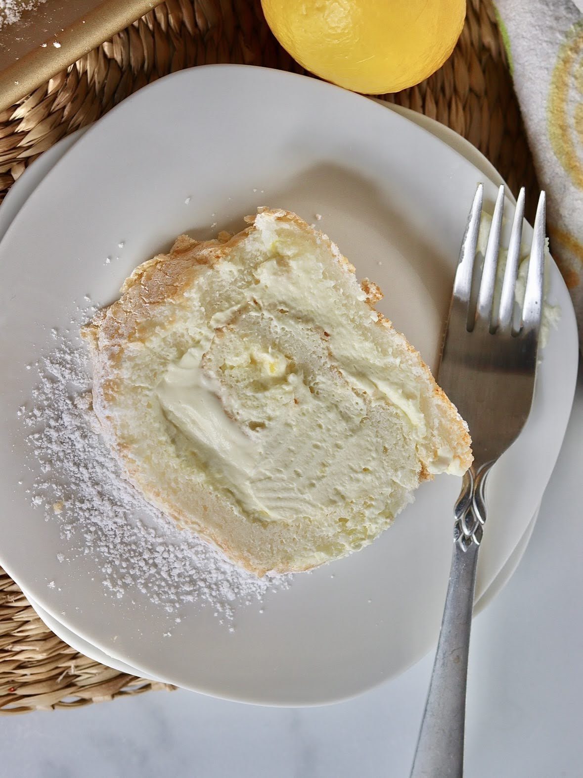 overhead photo of a slice of lemon angel food cake 